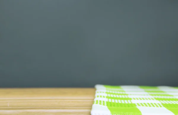 Background with wooden table and tablecloth — Stock Photo, Image