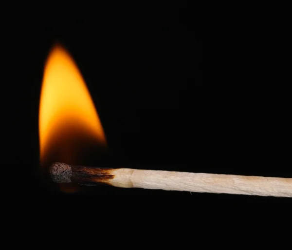 Burning match isolated on black — Stock Photo, Image