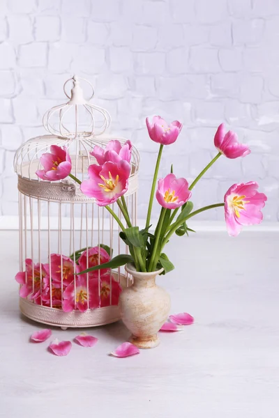 Beautiful pink tulips on grey wall background — Stock Photo, Image