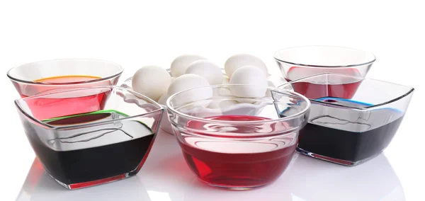 Eggs with liquid colour in glass bowls isolated on white — Stock Photo, Image