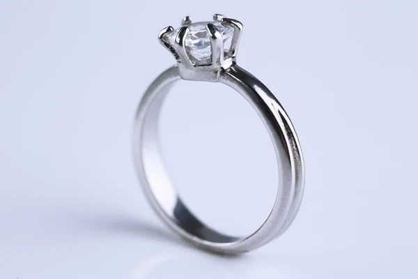 Beautiful diamond ring on light background — Stock Photo, Image