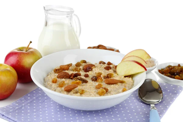 Sabrosa avena con pasas y manzanas aisladas en blanco — Foto de Stock