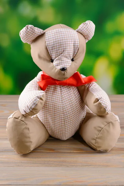 Bear toy on table on bright background — Stock Photo, Image