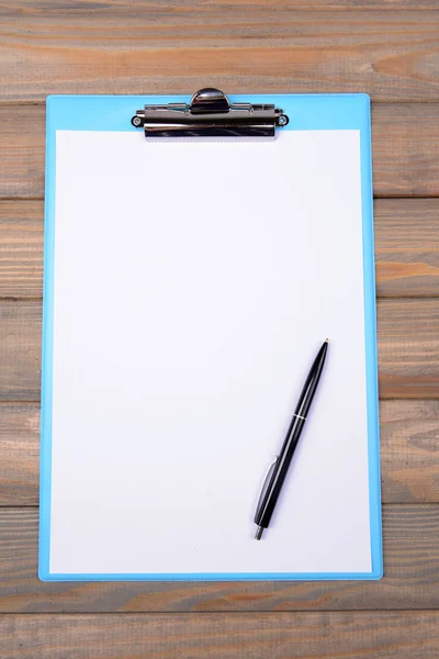 Clipboard on wooden background — Stock Photo, Image