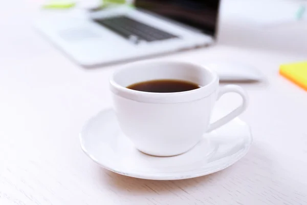 Cup of coffee at workplace — Stock Photo, Image