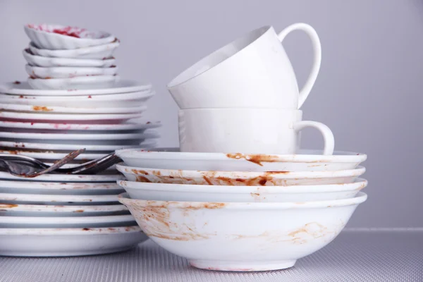 Dirty dishes on gray background — Stock Photo, Image