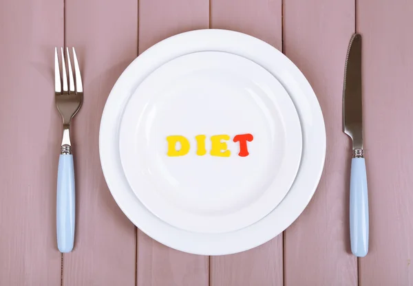 Plate with inscription diet on wooden table close-up — Stock Photo, Image