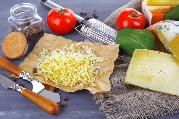 Different Italian cheese on wooden background — Stock Photo, Image