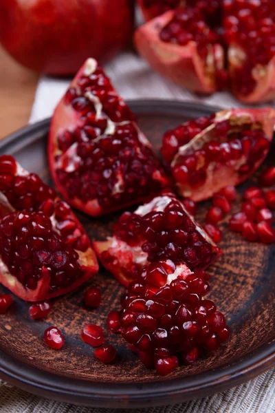 Ripe pomegranates on table close-up — Stock Photo, Image