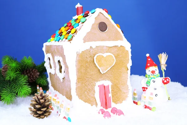 Gingerbread house on blue background — Stock Photo, Image