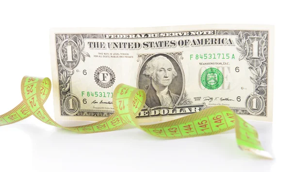 Svinovací metr s penězi izolovaných na bílém — Stock fotografie