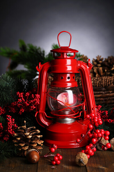 Red kerosene lamp on dark background