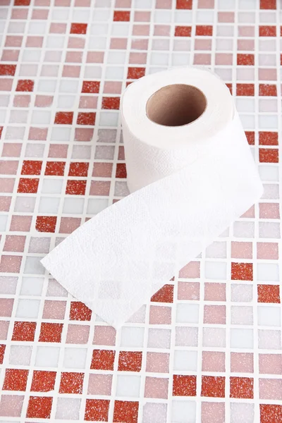 Color toilet paper roll on bright background — Stock Photo, Image