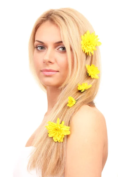 Beautiful young woman with a bright yellow chrysanthemums in her hair on white background close-up — Stock Photo, Image