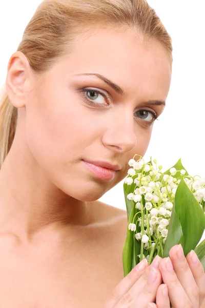 Beautiful young woman with a bouquet of lilies of the valley on white background close-up — Stock Photo, Image