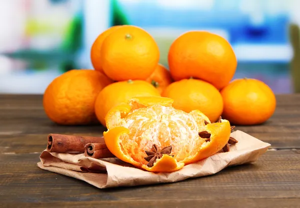 Ripe sweet tangerine, on wooden  table, on bright background — Stock Photo, Image