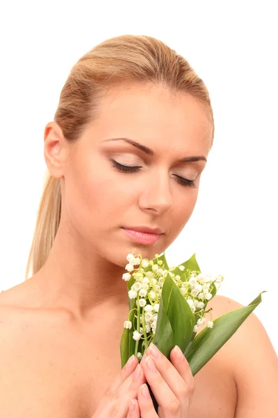 Gyönyörű fiatal nő, egy csokor gyöngyvirág a közeli fehér háttér — Stock Fotó