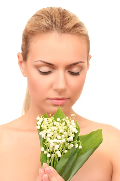 Beautiful young woman with a bouquet of lilies of the valley on white background close-up — Stock Photo, Image