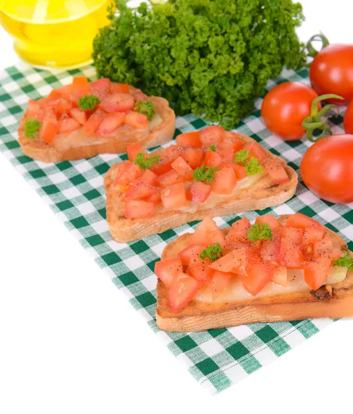 Heerlijke bruschetta met tomaten op tafel close-up — Stockfoto