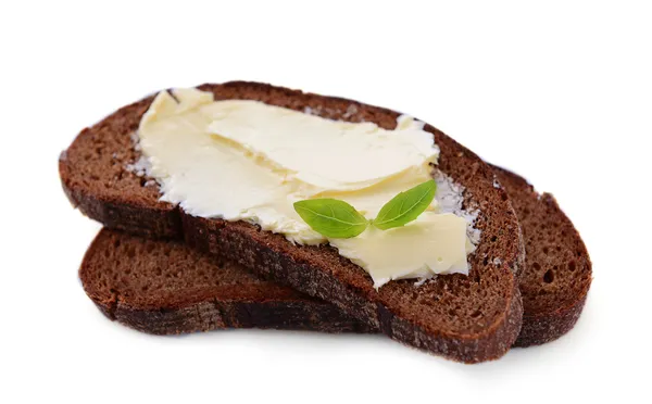 Rebanadas de pan de centeno con mantequilla, aisladas sobre blanco —  Fotos de Stock