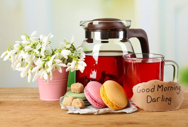 Tasty herbal tea and cookies on wooden table — Stock Photo, Image