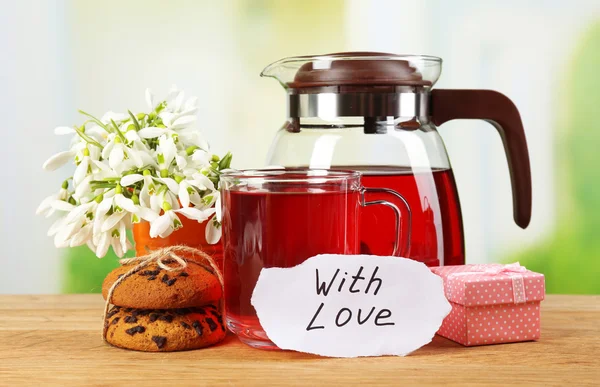 Tasty herbal tea and cookies on wooden table — Stock Photo, Image