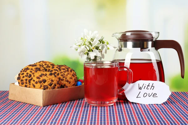 Tasty herbal tea and cookies on table — Stock Photo, Image