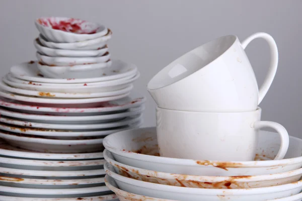 Dirty dishes on gray background — Stock Photo, Image