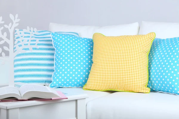 White sofa with colorful pillows in room — Stock Photo, Image