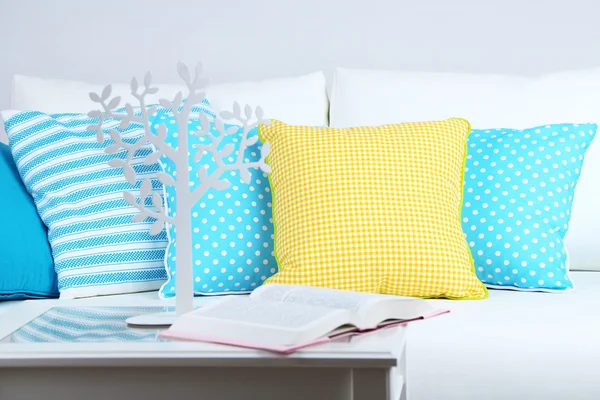 White sofa with colorful pillows in room — Stock Photo, Image