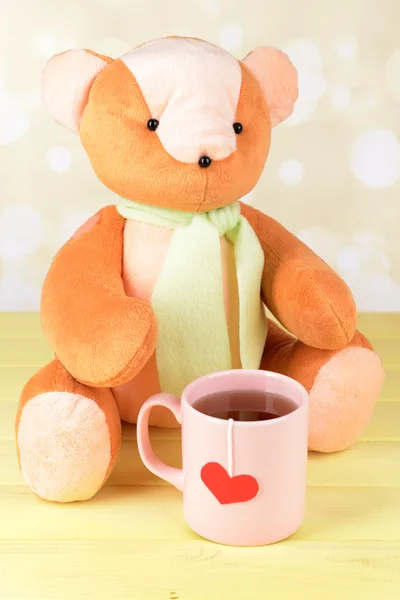 Bear toy on table on light background — Stock Photo, Image