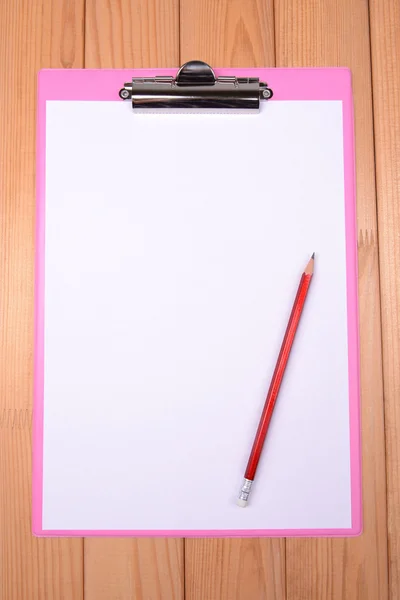 Clipboard on wooden background — Stock Photo, Image