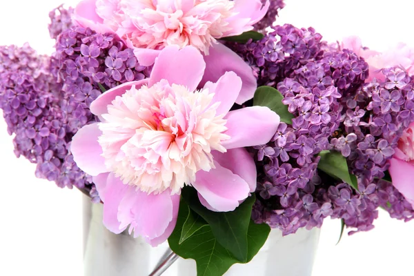 Beautiful lilac and peonies flowers in metal bucket isolated on white — ストック写真