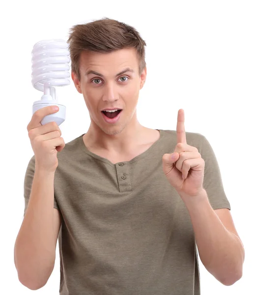Młody człowiek z lampy energooszczędne, biały na białym tle na — Zdjęcie stockowe