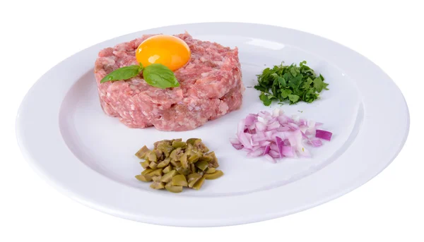 Delicious steak tartare with yolk on plate isolated on white — Stock Photo, Image