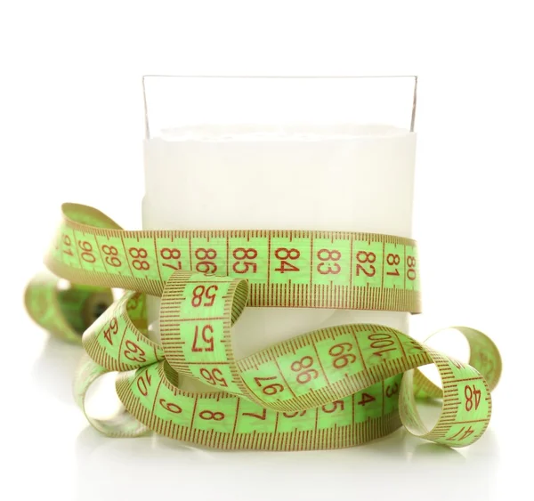 Glass of milk with measuring tape isolated on white — Stock Photo, Image