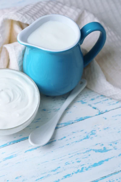 Dairy products on wooden table background — Stock Photo, Image