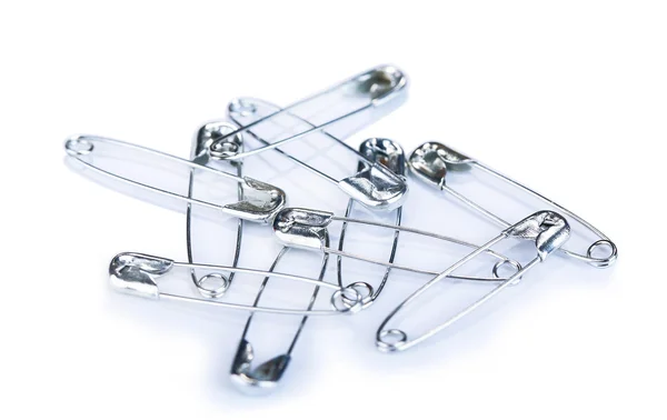 Safety pins on grey background — Stock Photo, Image