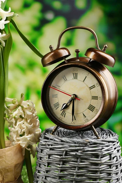 Alarm clock on nature background — Stock Photo, Image