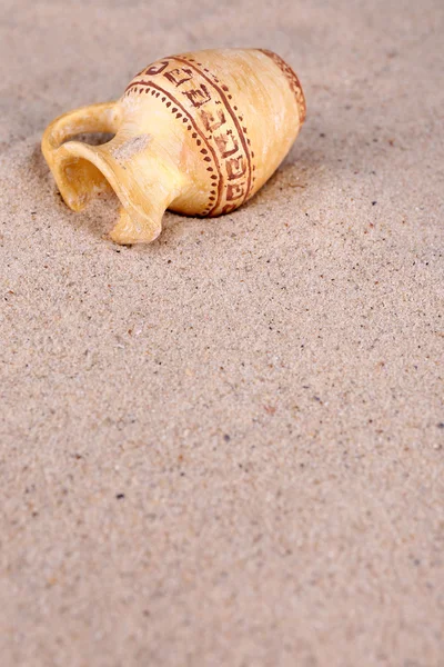 Greek ceramic amphora on sand, close up — Stock Photo, Image