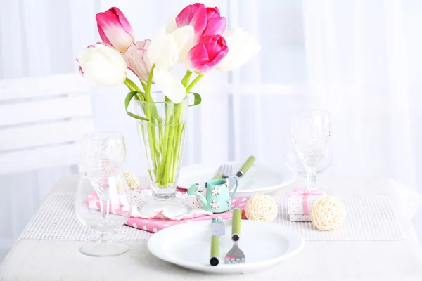 Beautiful spring table setting on light background — Stock Photo, Image