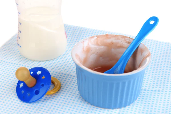 Żywności dla niemowląt i mleko na serwetka z bliska — Zdjęcie stockowe