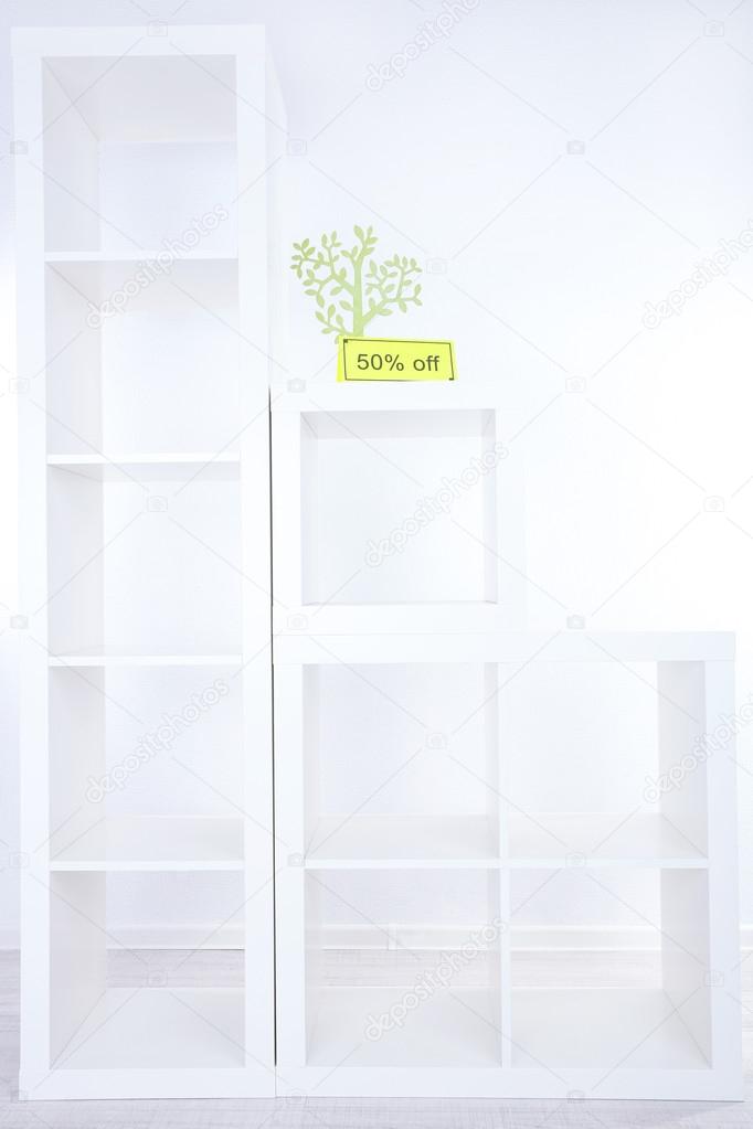 New white shelves with price on light background