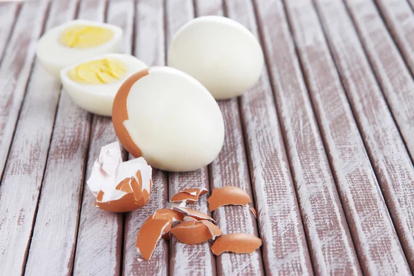 Peeled boiled egg on wooden background — Stock Photo, Image