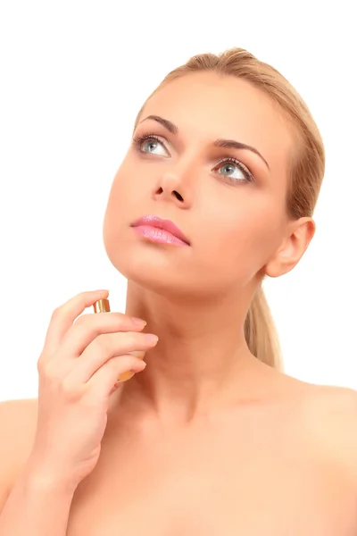 Charming young woman with perfume on white background close-up Stock Picture