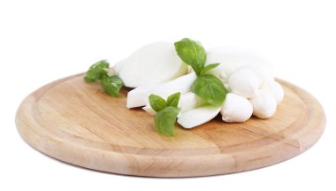 Tasty mozzarella with basil on wooden board isolated on white clipart