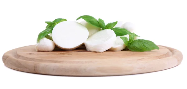 Tasty mozzarella with basil on wooden board isolated on white — Stock Photo, Image