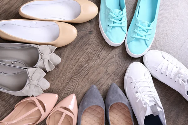 Different shoes on floor — Stock Photo, Image