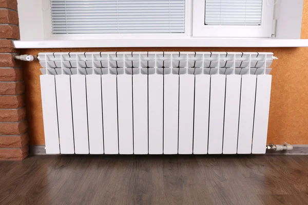 Heating radiator in room Stock Image