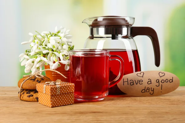 Tasty herbal tea and cookies on wooden table — Stock Photo, Image